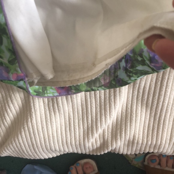 This is a floral jumpsuit with a scarf attached to the top of it on one side. - Picture 5 of 7